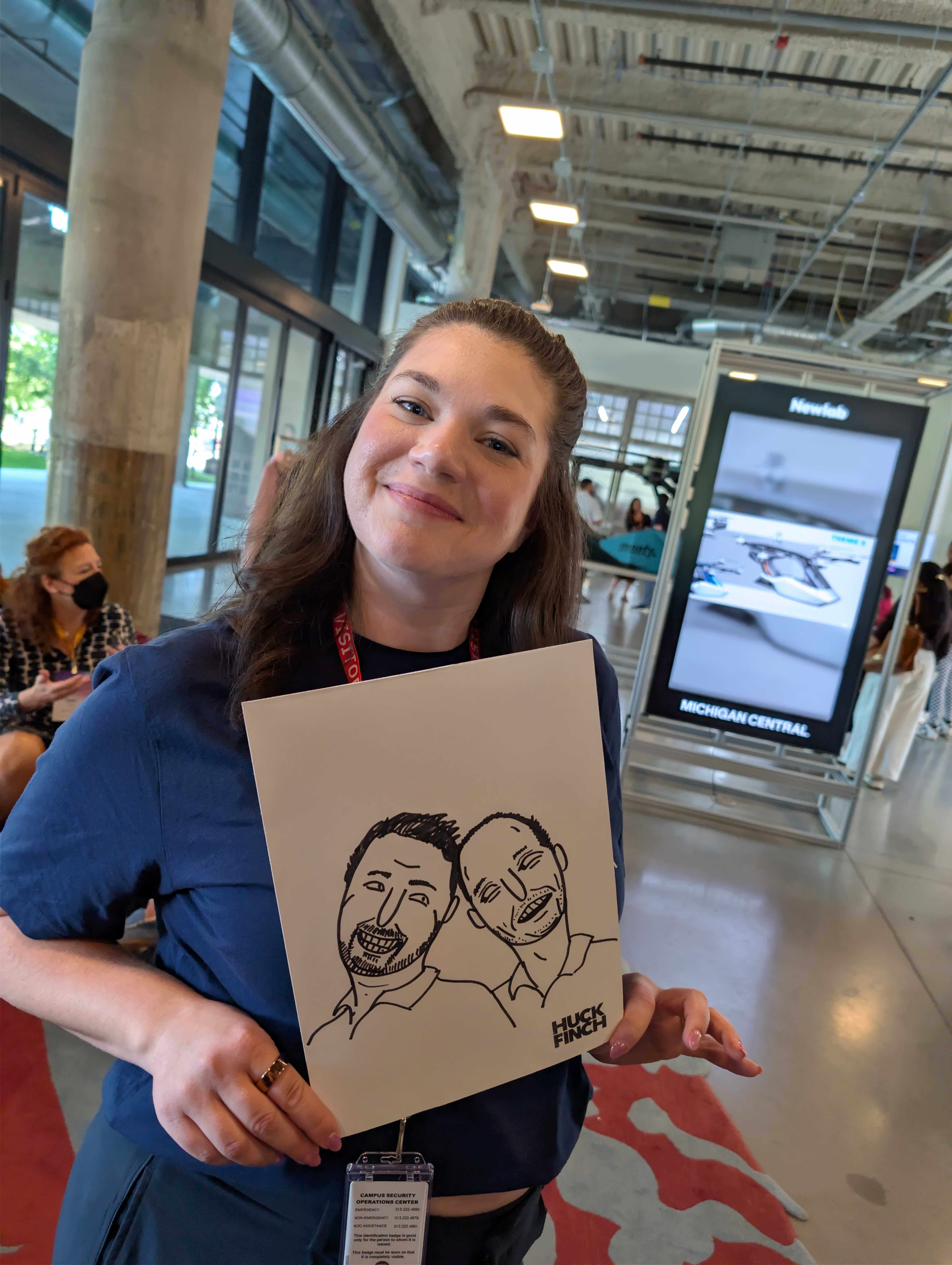 gener8tor team member posing with a painting at a team event