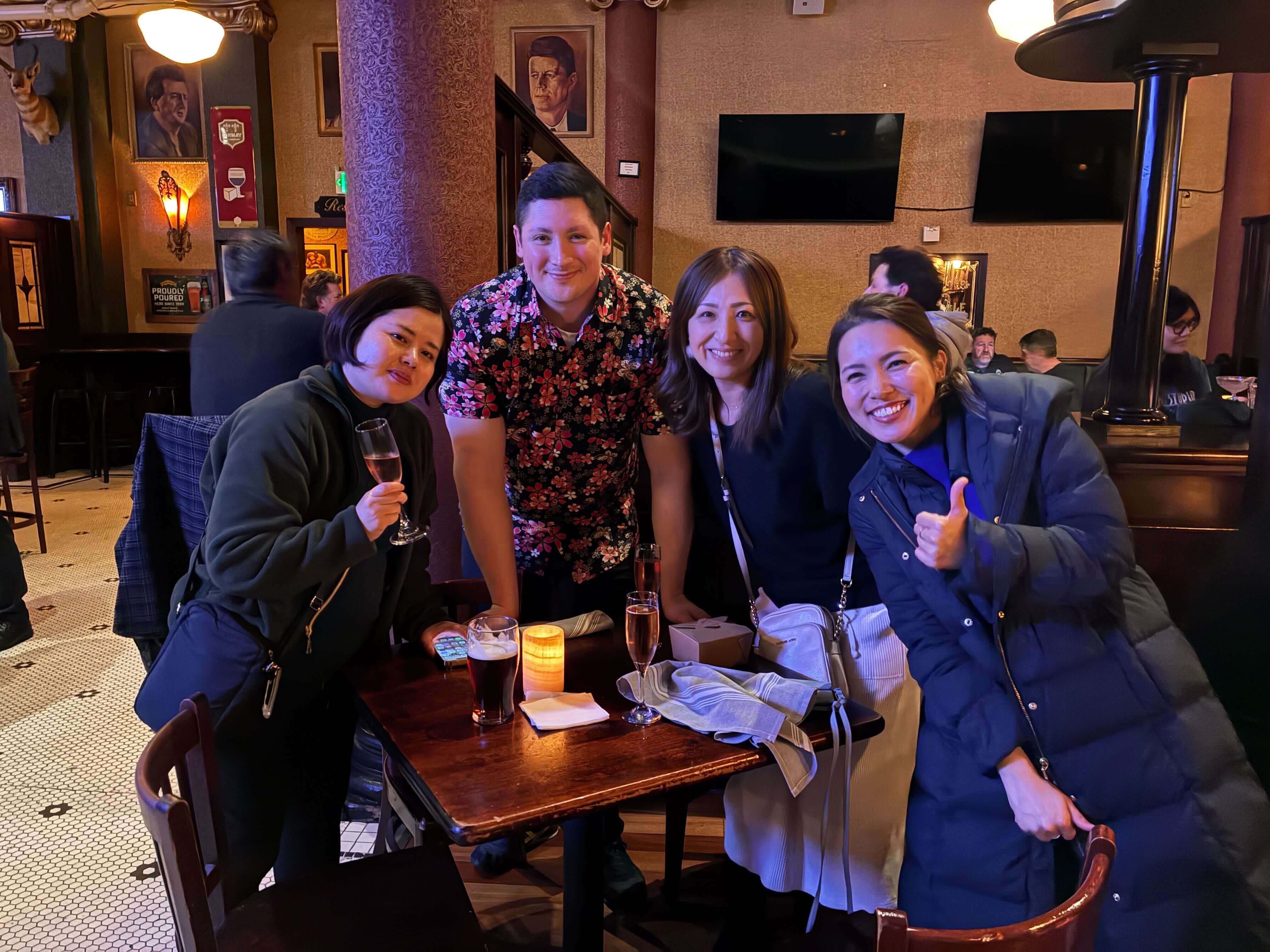 gener8tor team members smiling together at a restaurant outing