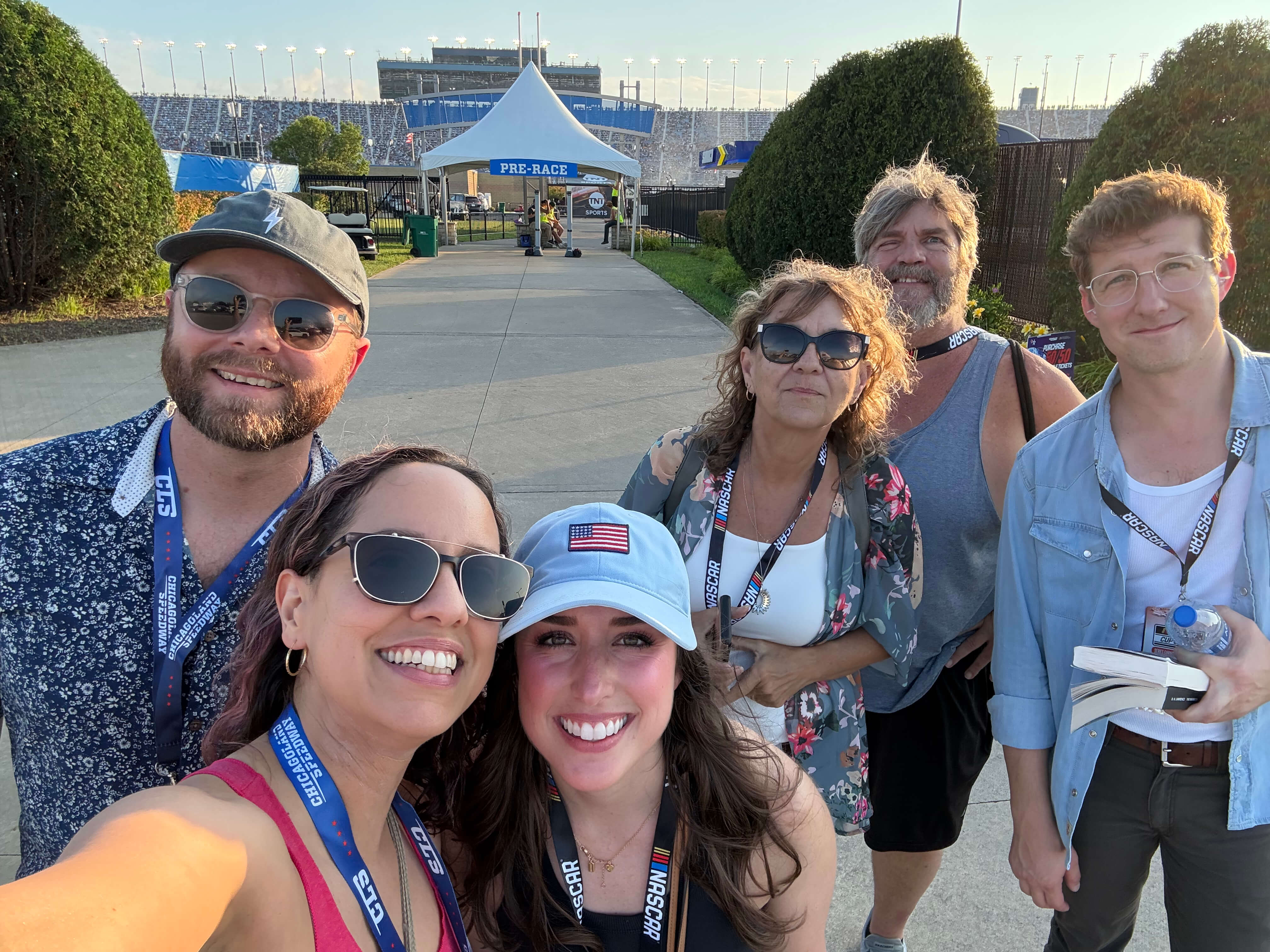 gener8tor team members smiling together at a NASCAR race