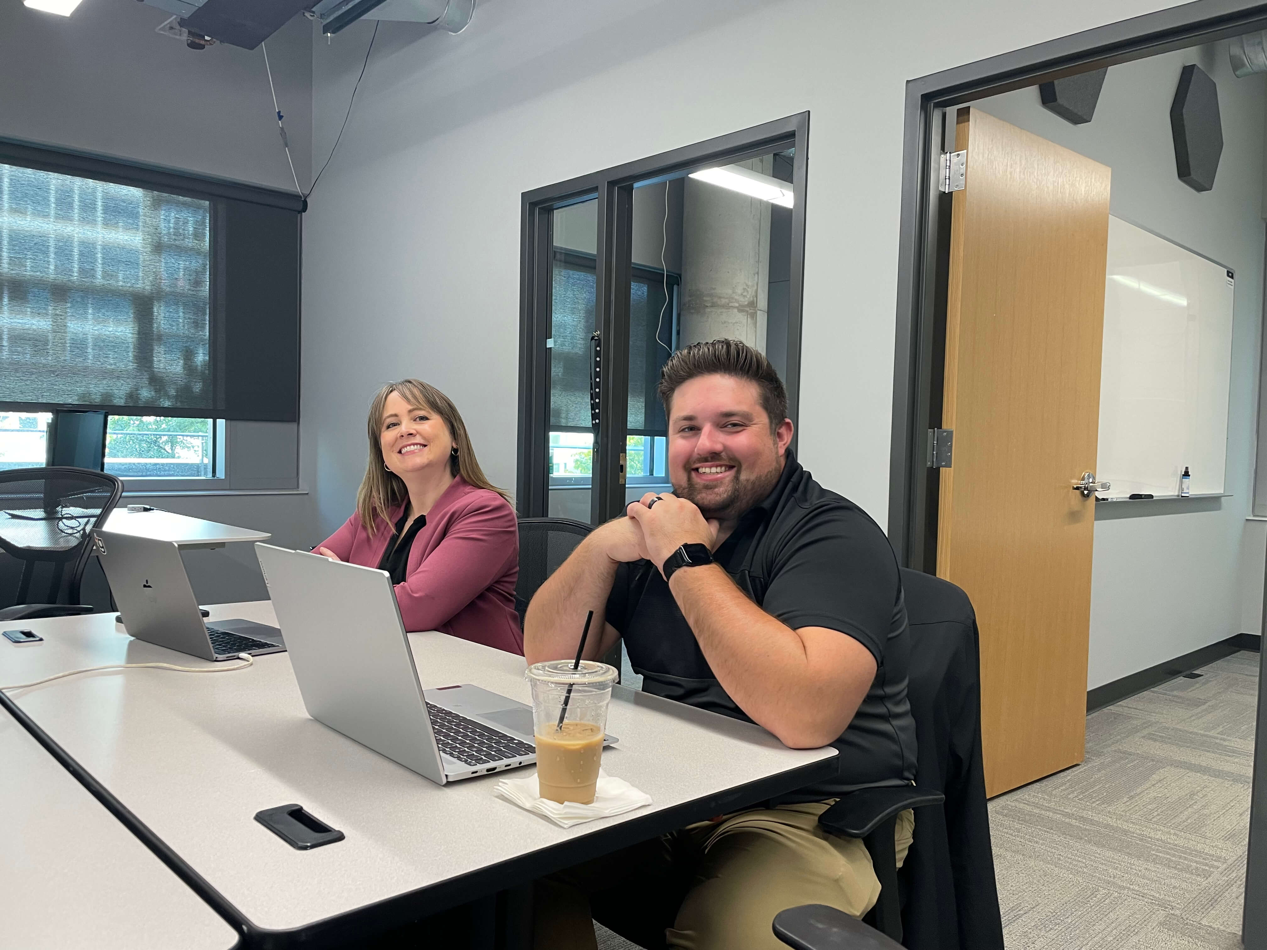 gener8tor team members smiling in the office with coffee