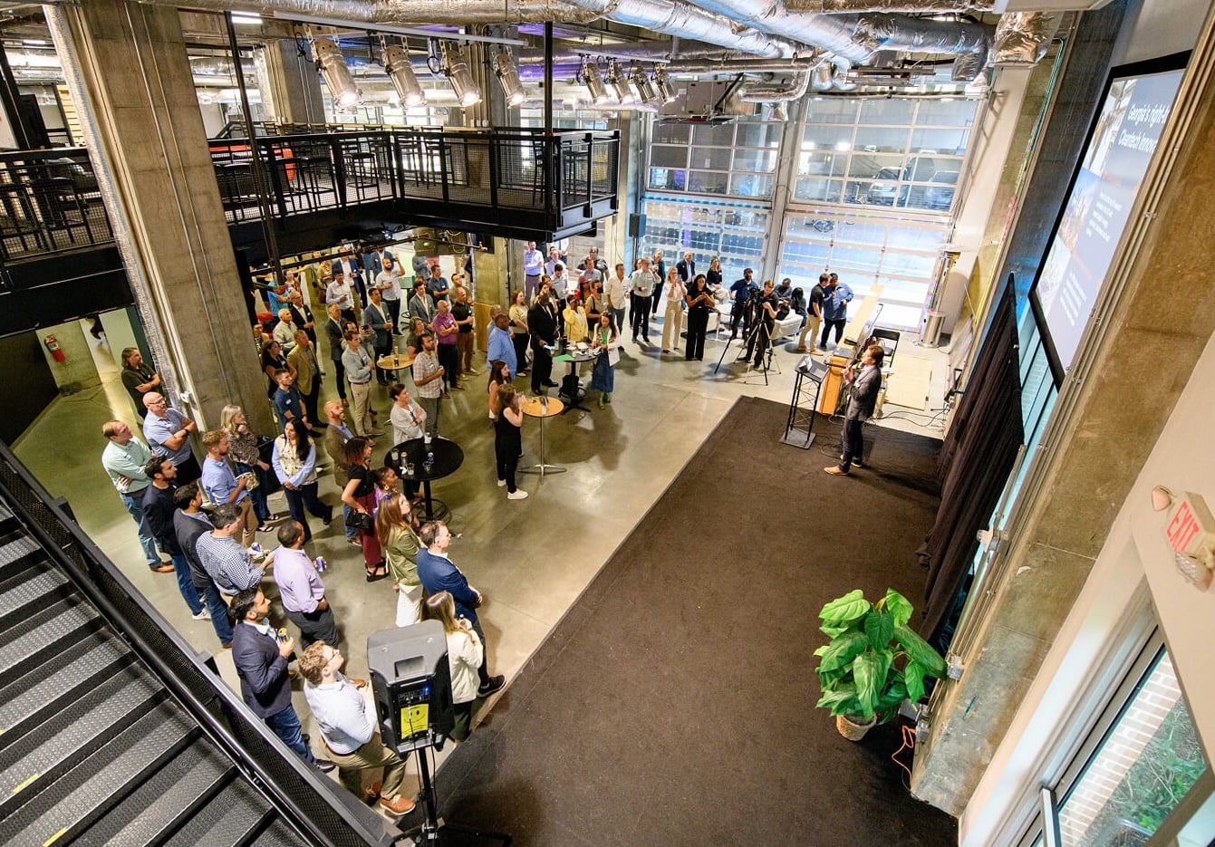 Large audience of startup founders and investors at a gener8tor accelerator community event
