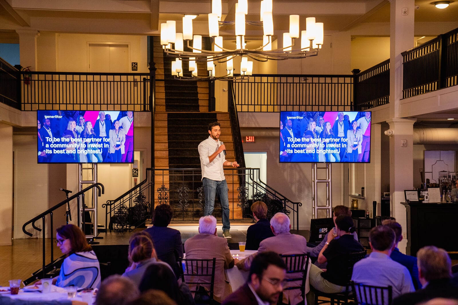 Keynote speaker on stage at a gener8tor startup accelerator showcase