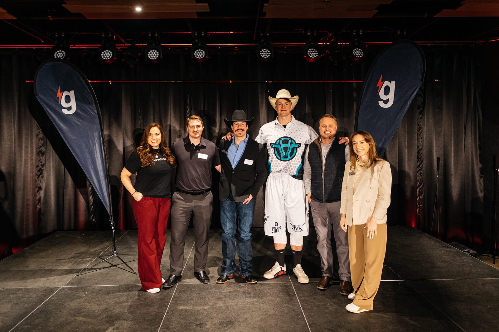 gener8tor accelerator cohort of startup founders celebrating on stage at a program showcase
