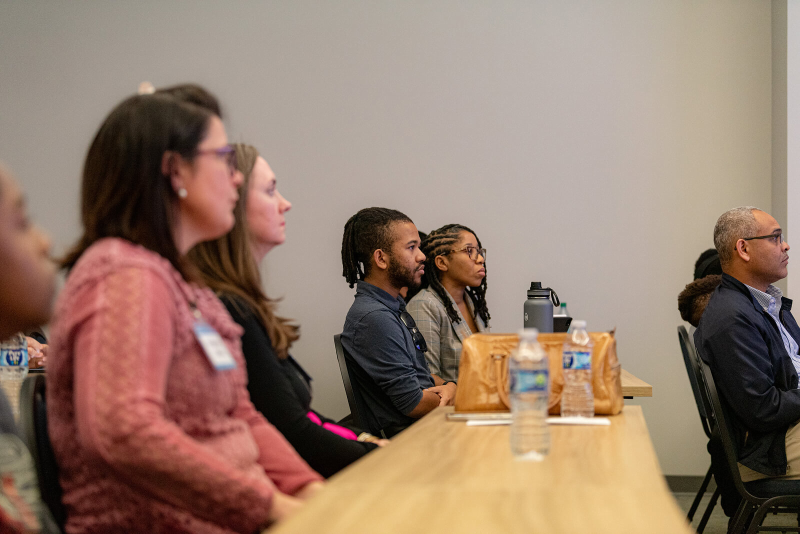 Participants sitting at tables during a gener8tor Spark workshop session
