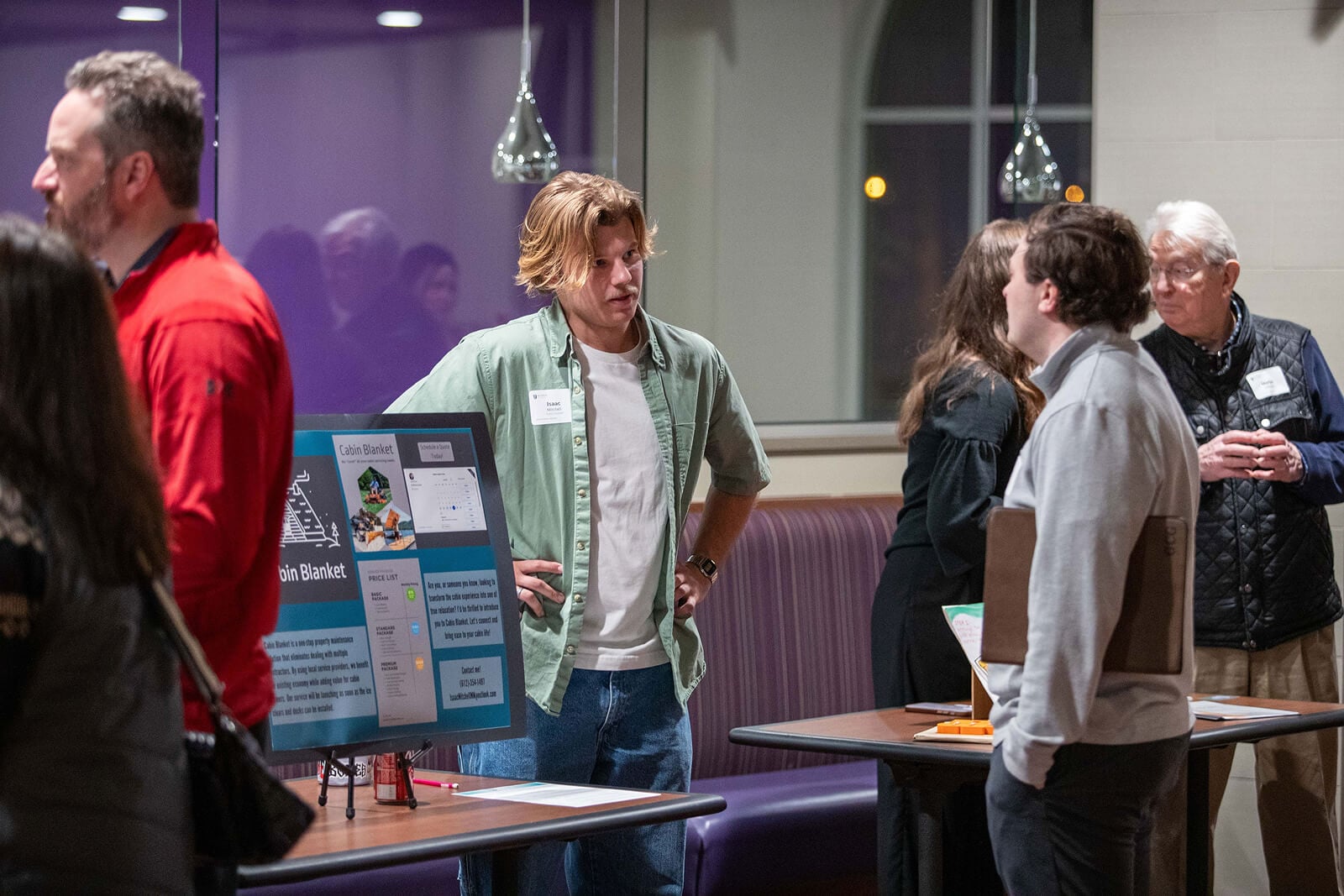 gALPHA startups presenting to potential customers at an exhibit hall